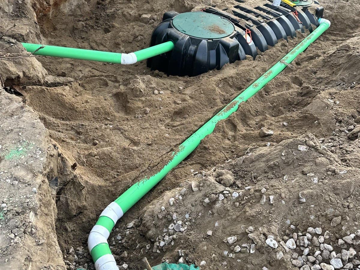 Septic tank install with green inlet lines