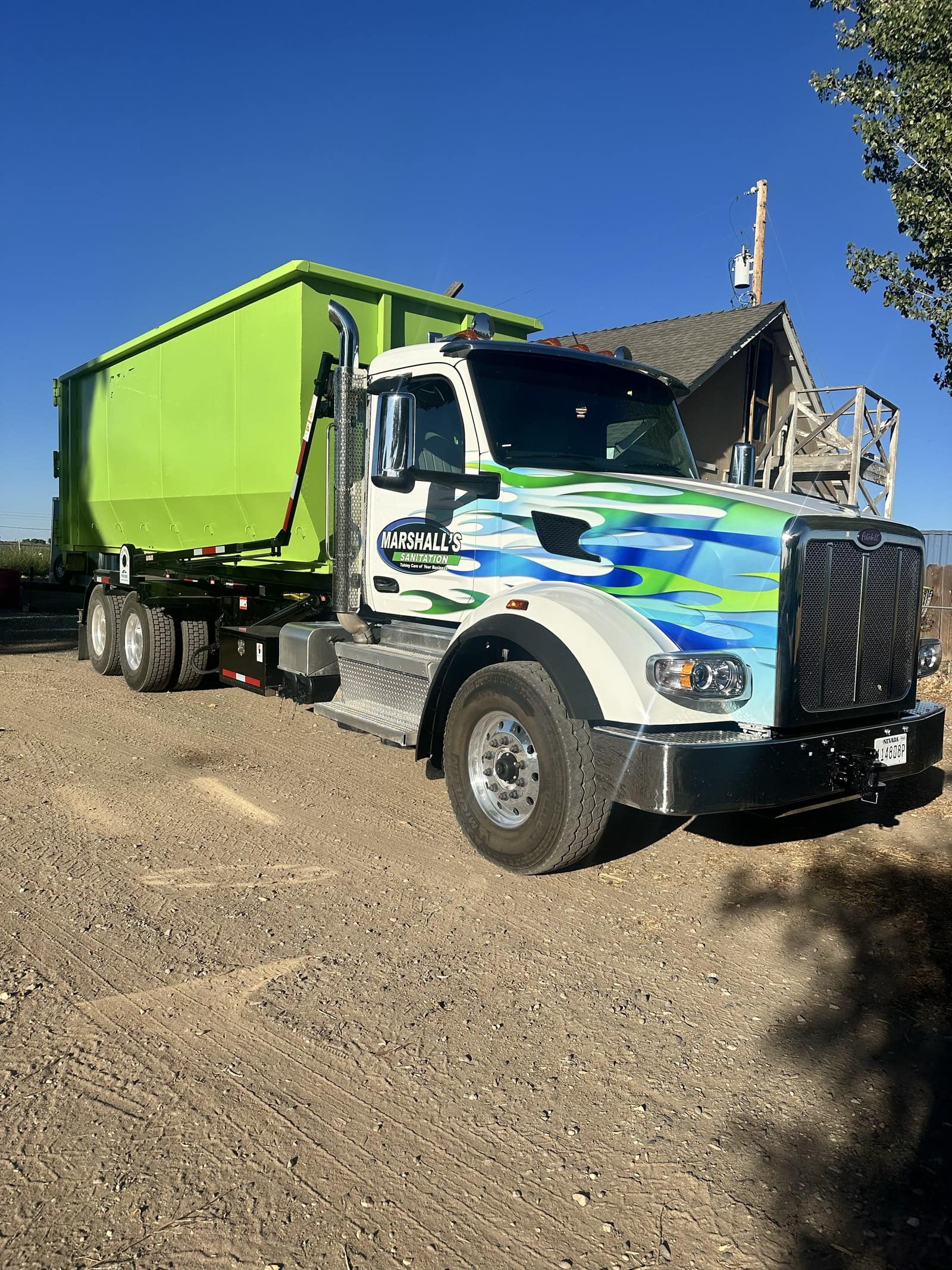 Marshall's Sanitation truck parked on a Nevada dirt road